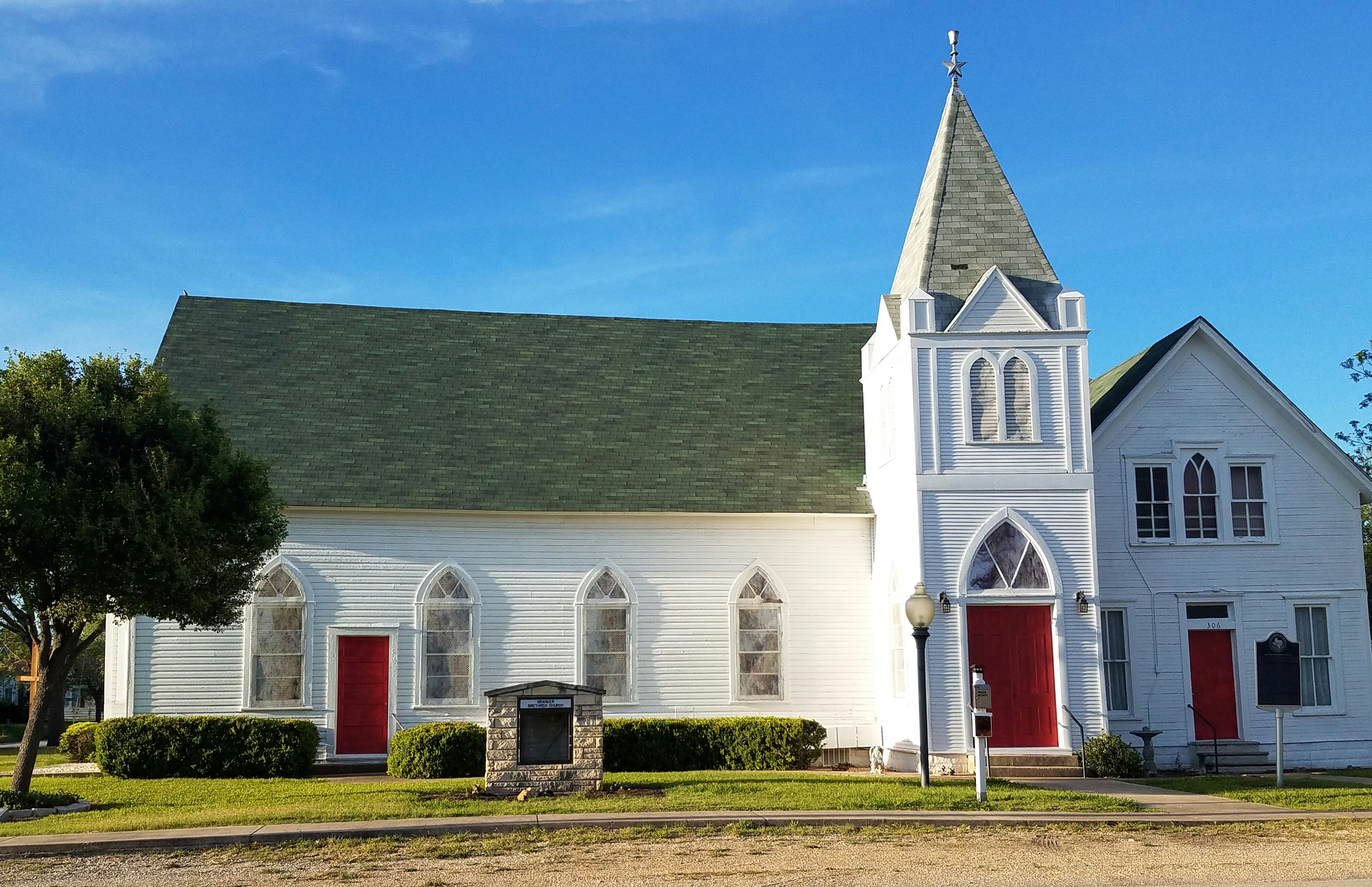 The church in afternoon light, three-quarter view.