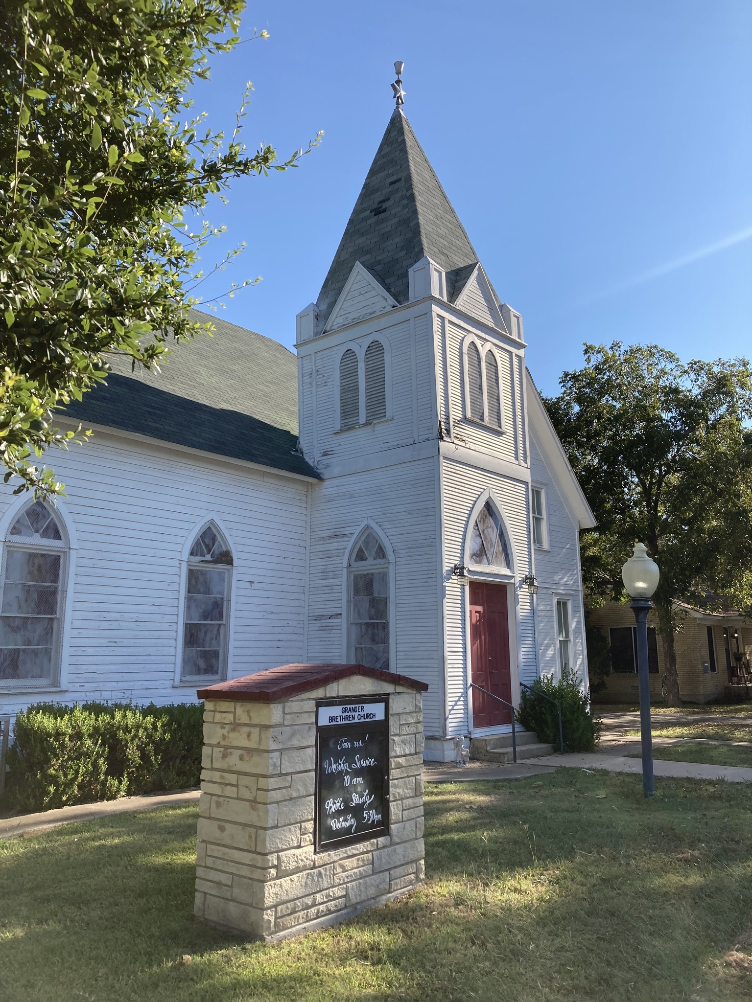 The church from the southwest with the bulletin board visible out front.